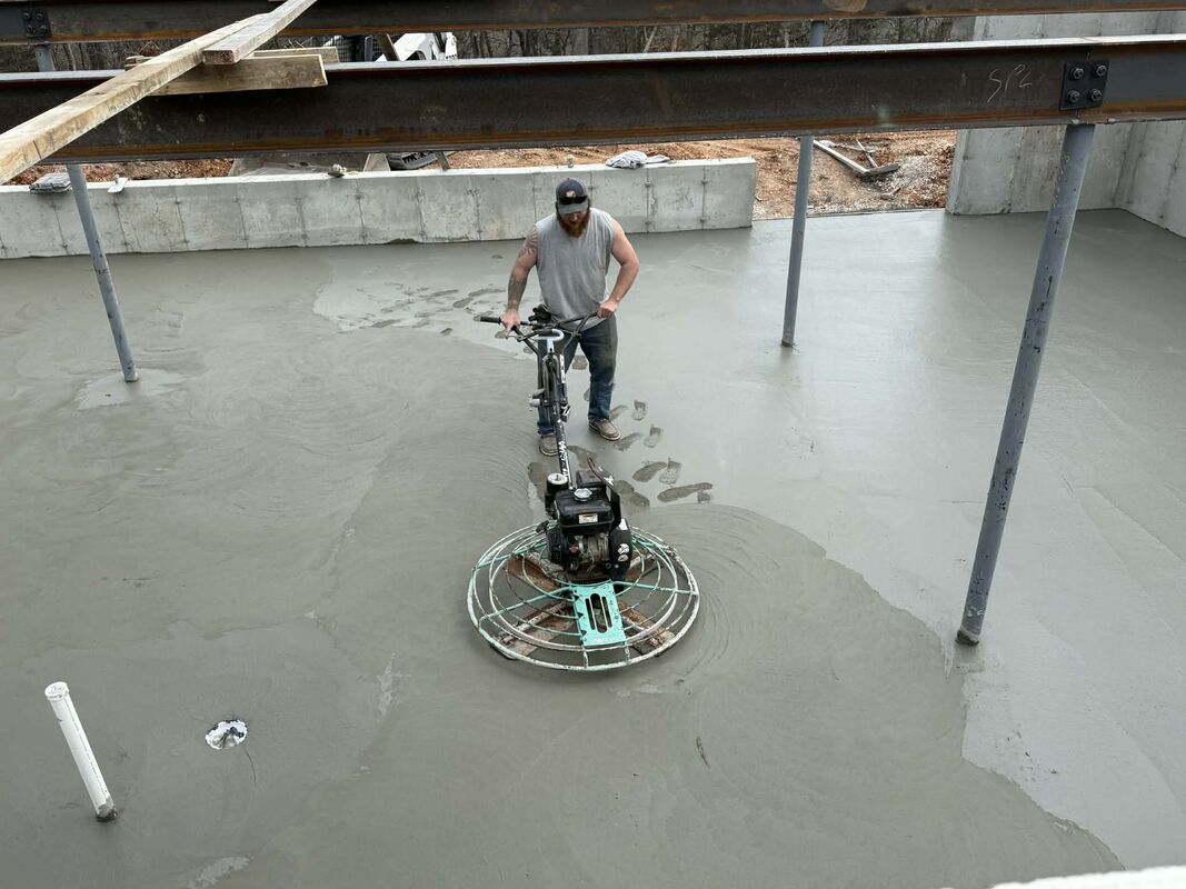 CW Concrete - power troweling a fresh concrete foundation