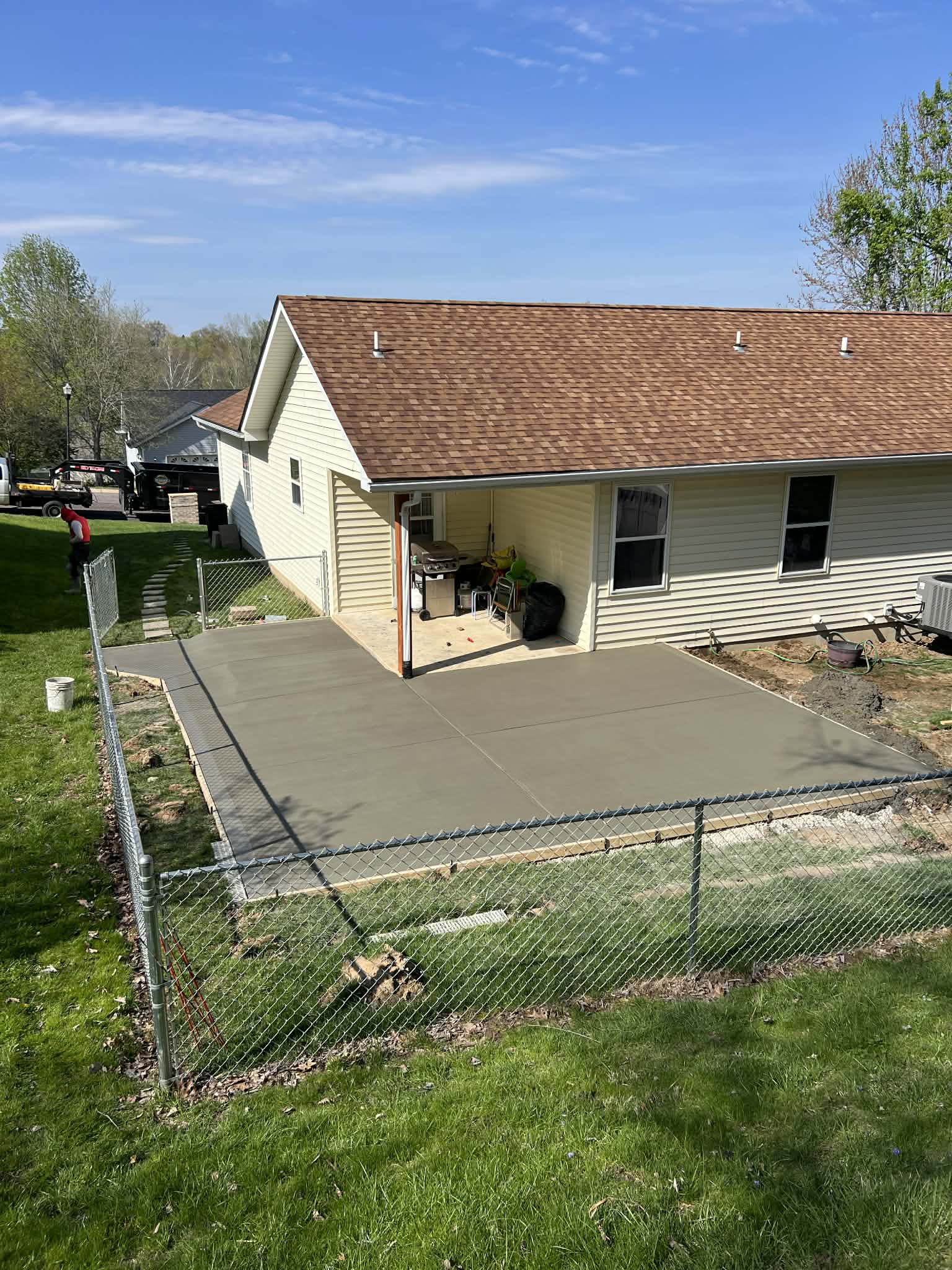 CW Concrete - finished backyard concrete patio on a sunny day