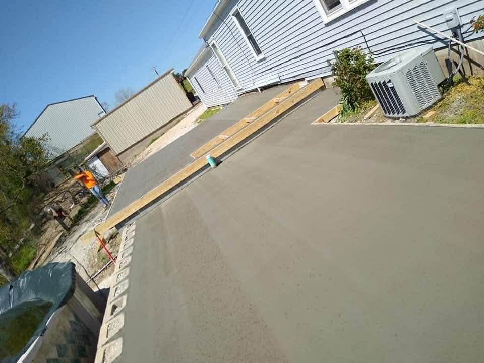 CW Concrete - new concrete sidewalk alongside a home