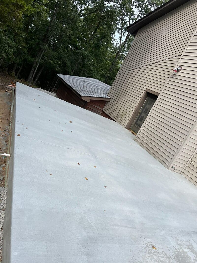 CW Concrete - finished concrete driveway beside house